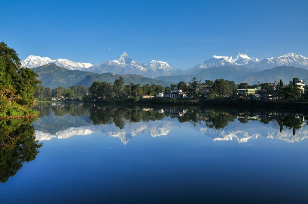 Photo of Pokhara with Mountains in the background and Fewa Lake on the front